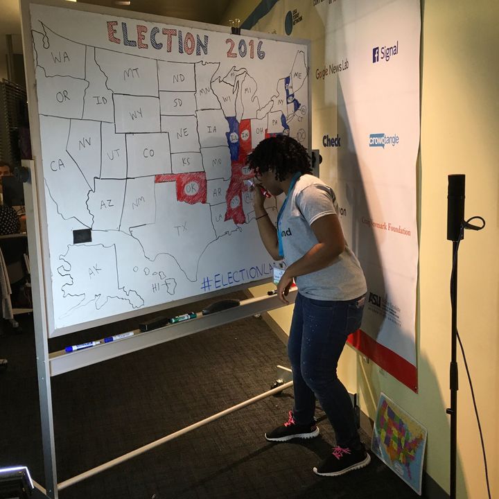 CUNY Social Journalism student Sasha Fountain works on our old-school map during our Facebook Live coverage on Election Day. 