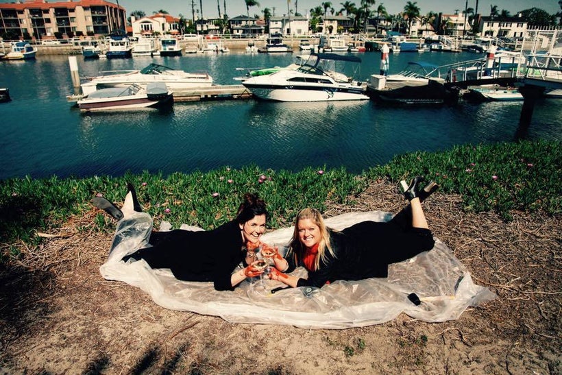 <em>White Wine True Crime</em> podcast hosts and comedians Caitlin Cutt (left) and Kari Martin