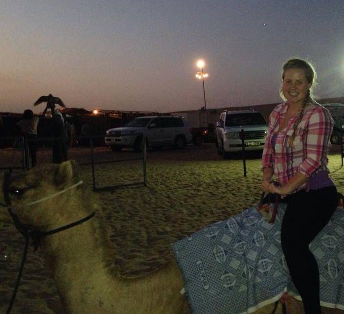 <p>Me riding a camel during a cultural excursion in the UAE desert. </p>
