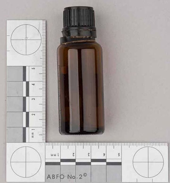 <strong>A Met police handout of a brown container containing GBL found in a bag next to victim Anthony Walgate </strong>