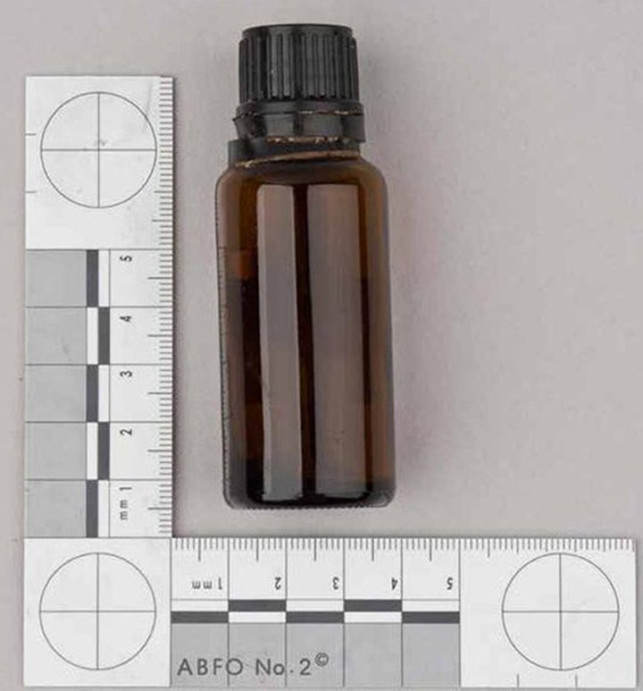 A Met police handout of a brown container containing GBL found in a bag next to victim Anthony Walgate 