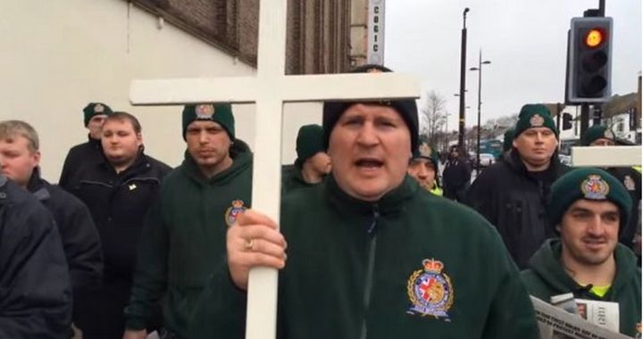 <strong>A Labour MP wants Britain First to be classified as a terrorist group; the political party's former leader, Paul Golding, is pictured above during the group's Christian patrol in Luton</strong>