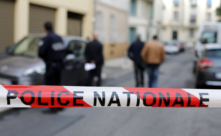 Police are searching for an armed suspect after finding a dead woman in a retirement home in France. Pictured here, poli