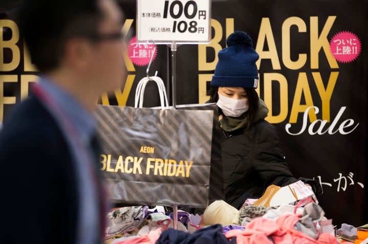 What actually happened: A customer shops for clothing during the Black Friday sale at an Aeon supermarket on November 25, 2016 in Tokyo, Japan