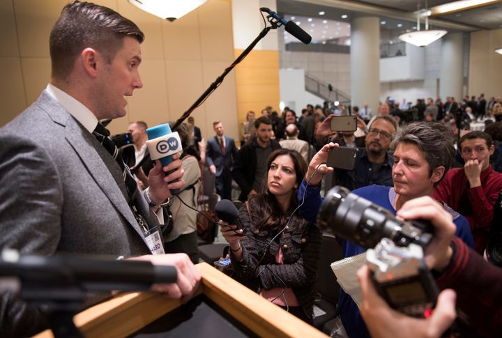 <strong>Richard Spencer (left) talks to the media at the National Policy Institute conference</strong>