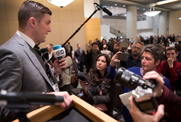 Richard Spencer (left) talks to the media at the National Policy Institute conference