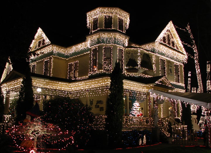 Victorian home adorned to celebrate the holiday season.