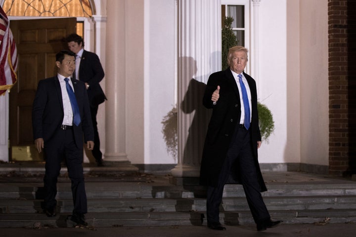 Trailed by U.S. Secret Service agents, President-elect Donald Trump leaves the clubhouse following a full day of meetings at Trump International Golf Club, November 20, 2016 in Bedminster Township, New Jersey.