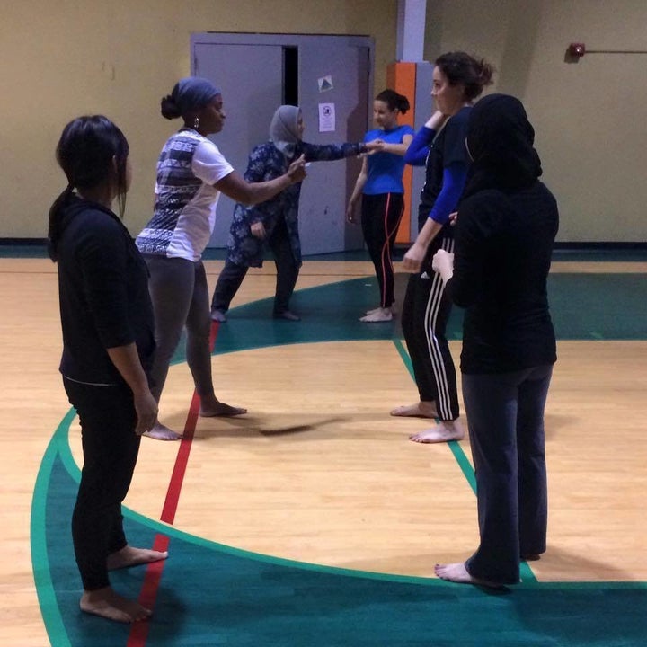 Women participate in a self-defense class at Deaf Planet Soul.