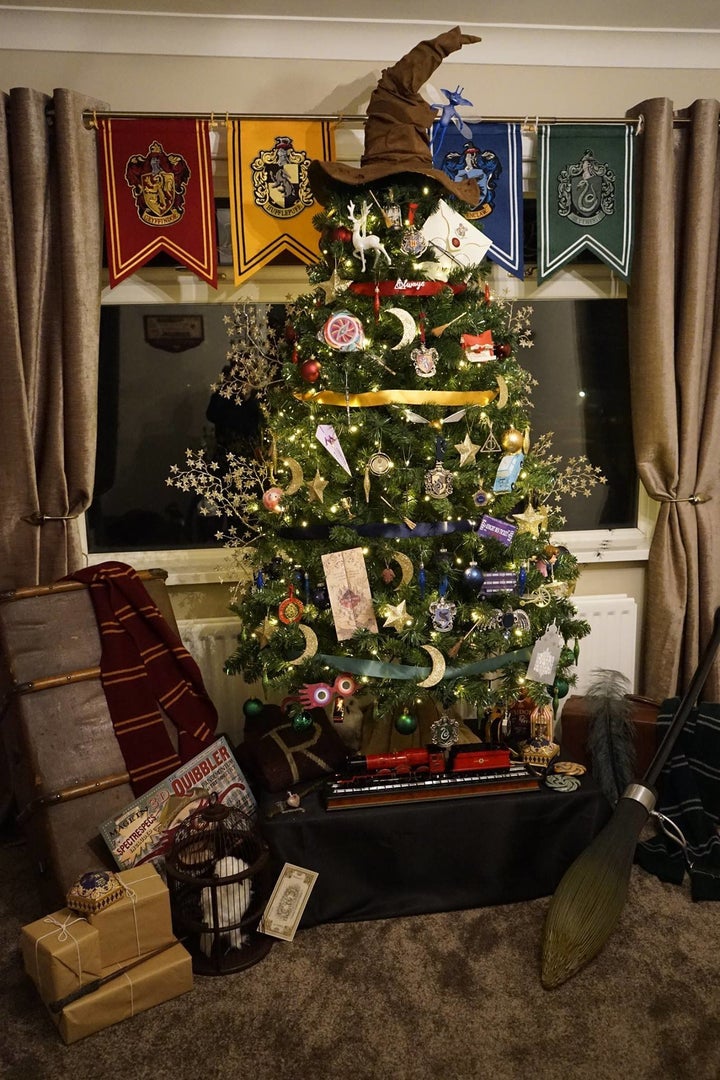 Presents, a scarf, a tiny Hogwarts Express replica and an owl complete the tree's look.