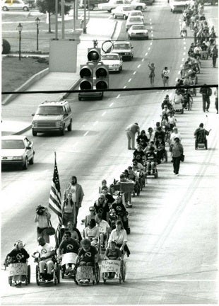 <p><strong>Photo: ADAPT disability rights activists marching in the streets in protest in 1990. </strong></p>