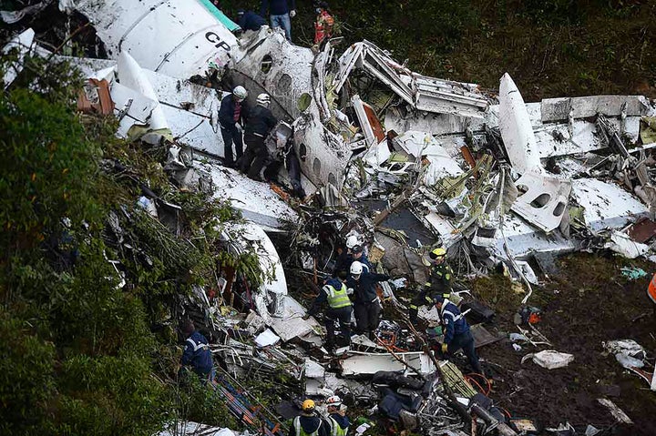 Rescue workers search amongst the wreckage