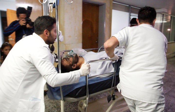 Brazilian soccer player Alan Luciano Ruschel of Chapecoense soccer club receives medical attention after a plane crash in Antioquia, central Colombia November 29, 2016.