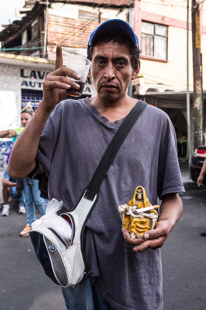 <p>Santa Muerte devotee who brought his Bony Lady to be blessed at the Tepito shrine</p>