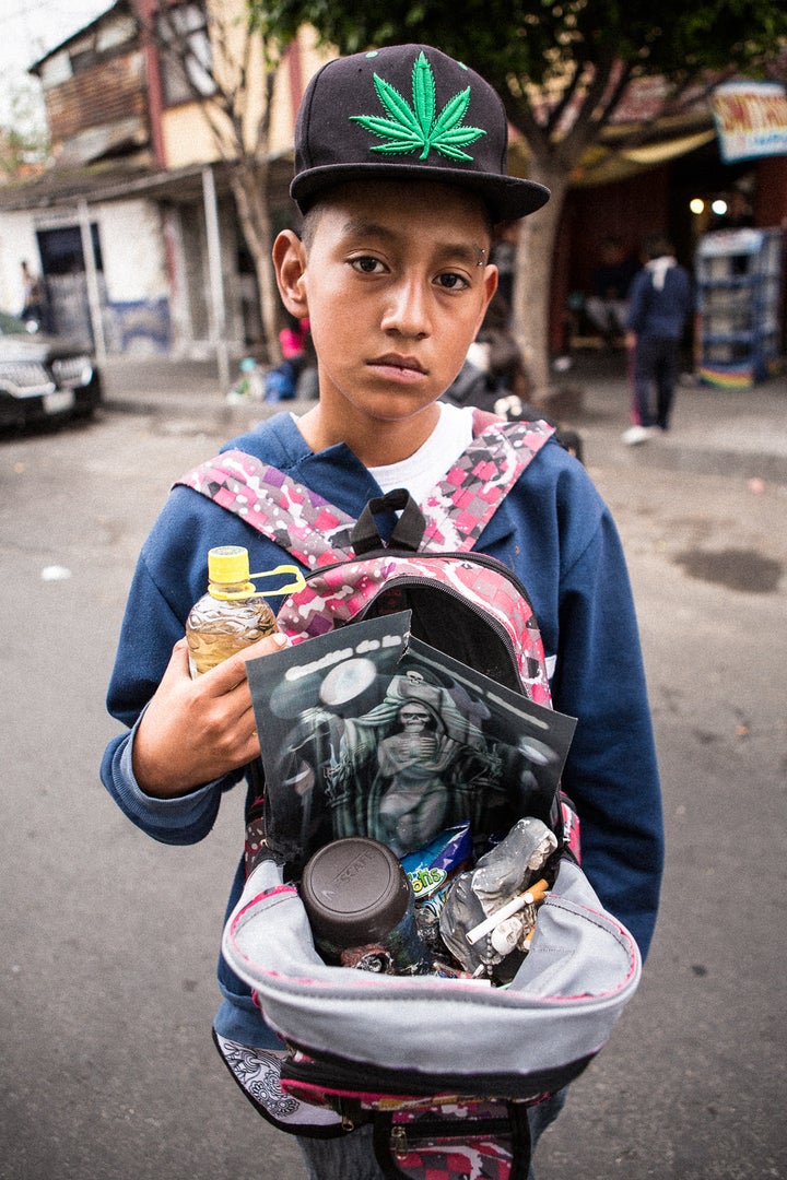 <p>Portable Death - Many Santa Muerte devotees bring their images to the Tepito shrine in backpacks</p>