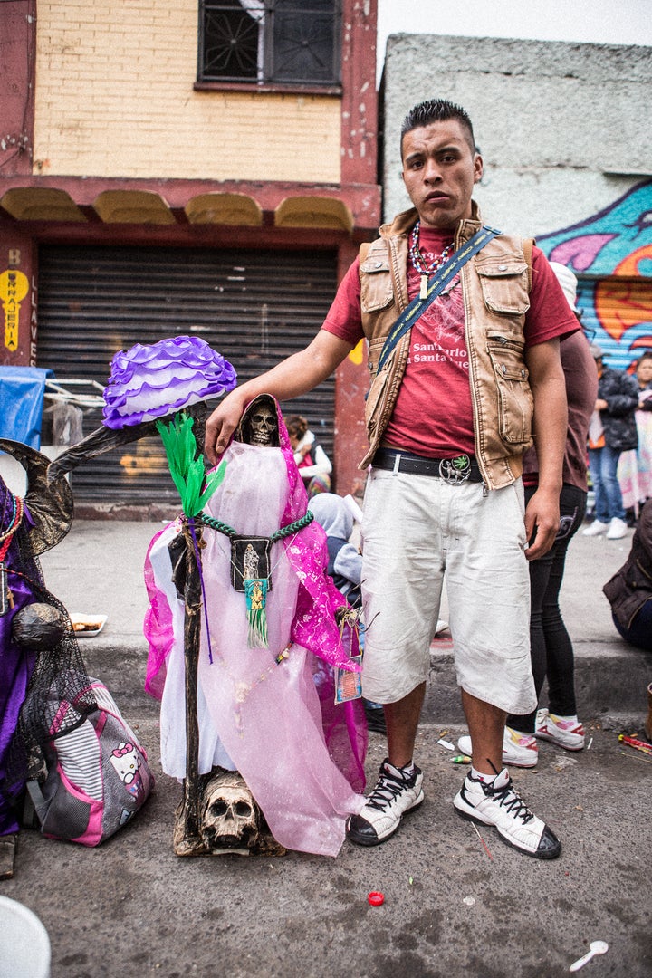 A devotee who brought his artisanal Santa Muerte to the Tepito shrine for blessing