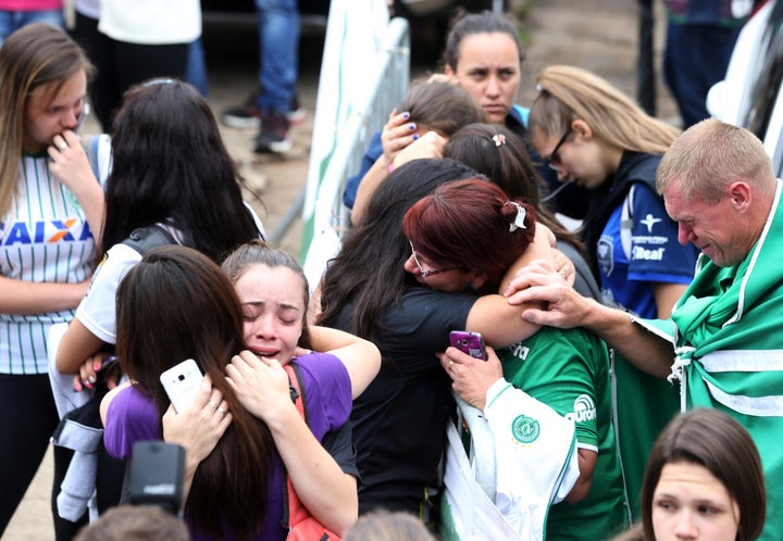 Fans of Chapecoense soccer team react in front of the Arena Conda stadium in Chapeco, Brazil, November 29, 2016.