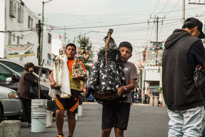 <p>Boys with Bony Ladies on their way to the Santa Muerte shrine in Tepito</p>