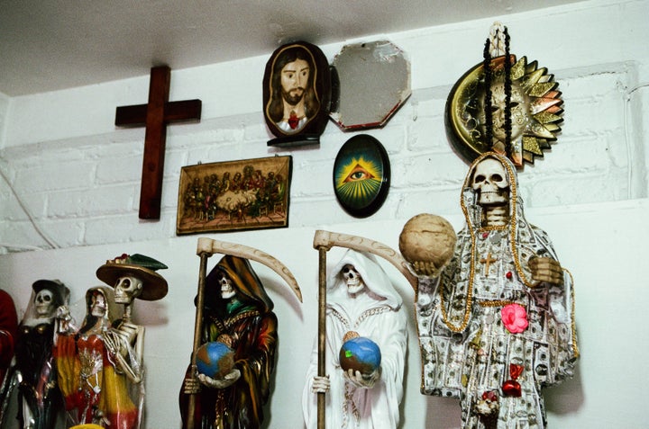 Santa Muertes and Catholic images at the home of Enriqueta Romero