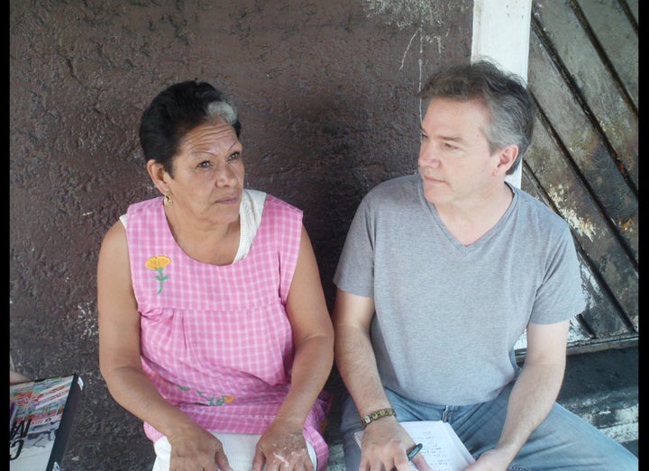 <p>Enriqueta Romero and Andrew Chesnut at her Santa Muerte shrine in Tepito, July 2009</p>