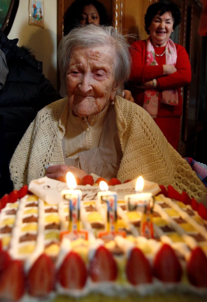 Emma Morano, thought to be the last living person born in the 1800s, admires her 117th birthday cake in Verbania, Italy, on Nov. 29, 2016.