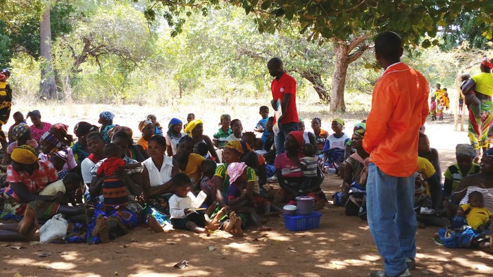 Volunteers with Malaria Consortium's pilot program leading a community dialogue in Nampula.