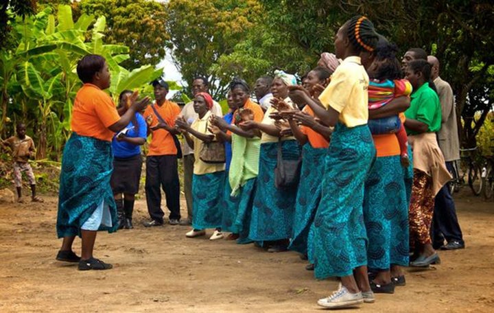 <p>Community volunteers greet visitors at an Early Childhood Development Center in Zambia</p>