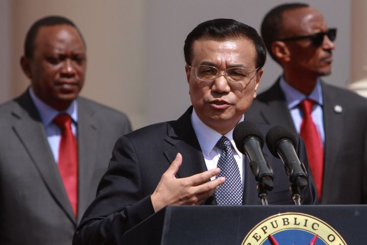 China's Prime Minister Li Keqiang (center) joins Kenyan President Uhuru Kenyatta (left) and Paul Kagame of Rwanda (right) during a visit in which he signed an African railway construction deal in 2014. 