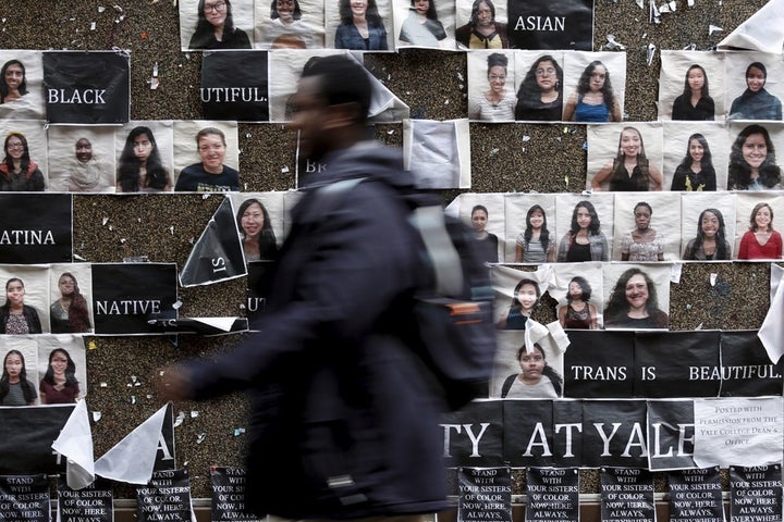 Yale student walks past a college noticeboard, prior to a college-wide discussion on race and diversity.