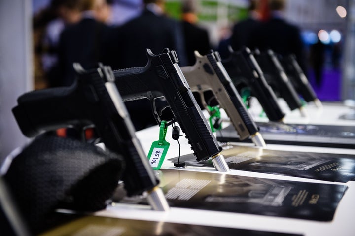 Pistols made by weapons manufacturer CZ sit on display inside the ExCeL centre in London on September 15, 2015, during the Defence and Security Equipment International (DSEI) exhibition.