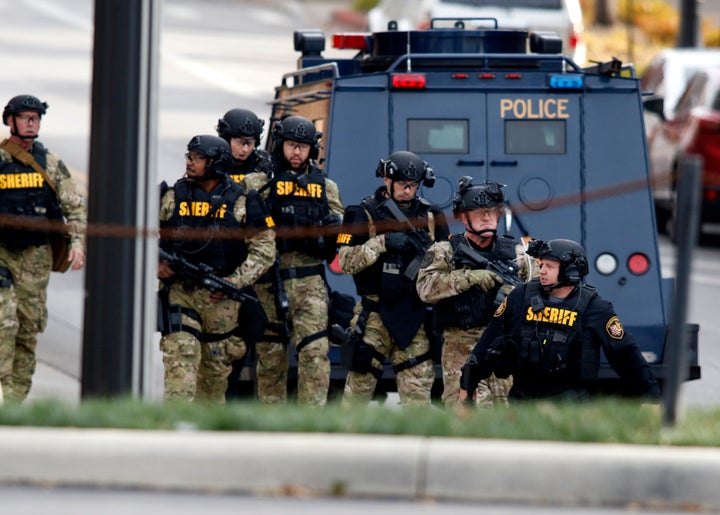 Law enforcement officials are seen outside of a parking garage on the campus of Ohio State University as they respond to an active attack in Columbus, Ohio, on November 28, 2016.