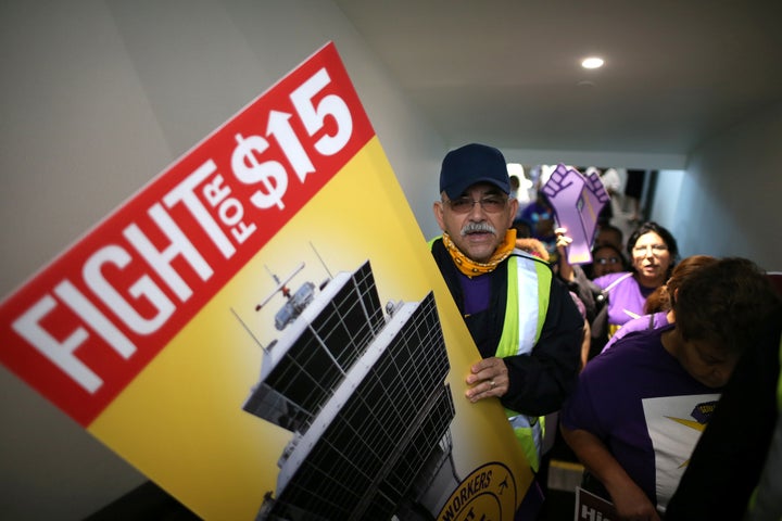 Workers nationwide advocated for a minimum wage of $15 an hour Tuesday, including this group at Los Angeles International Airport.