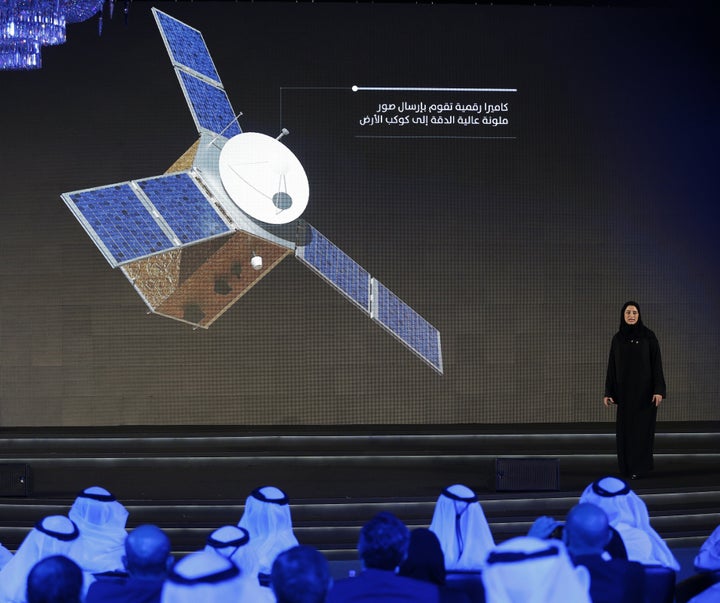 Sarah Amiri, deputy project manager of the United Arab Emirates (UAE) Mars Mission, stands on stage during a ceremony to unve