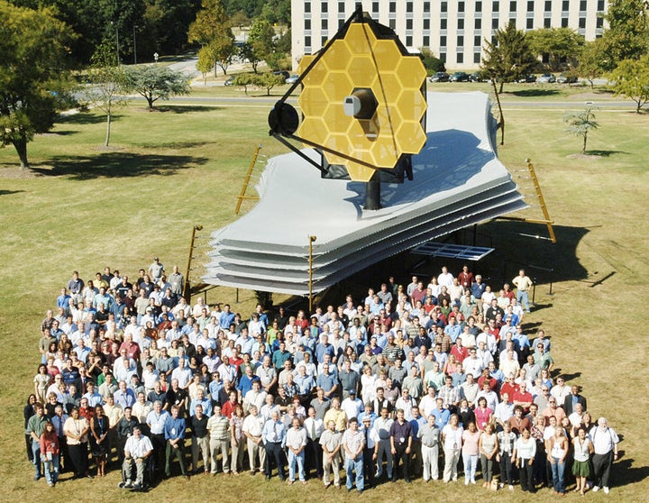 Team members with full-scale model of the Webb Telescope at Goddard Space Flight Center in Maryland.