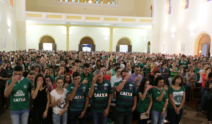 Fans attend a mass at the Santo Antonio Cathedral in Chapeco, Brazil