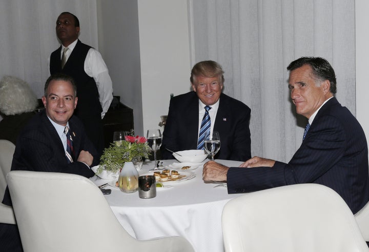 Mitt Romney gets cozy with Reince Priebus and President-elect Donald Trump at dinner Tuesday night.