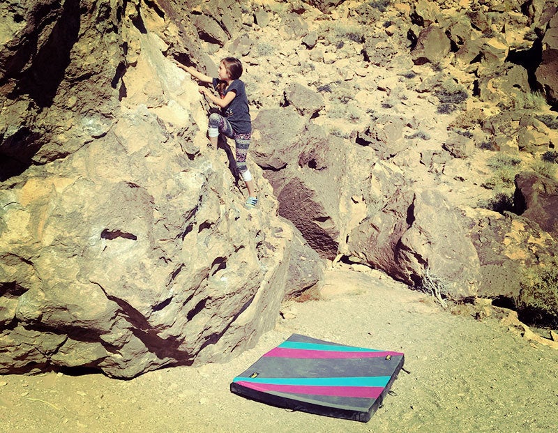 Our 8 year old daughter working on one of her climbing “projects.”