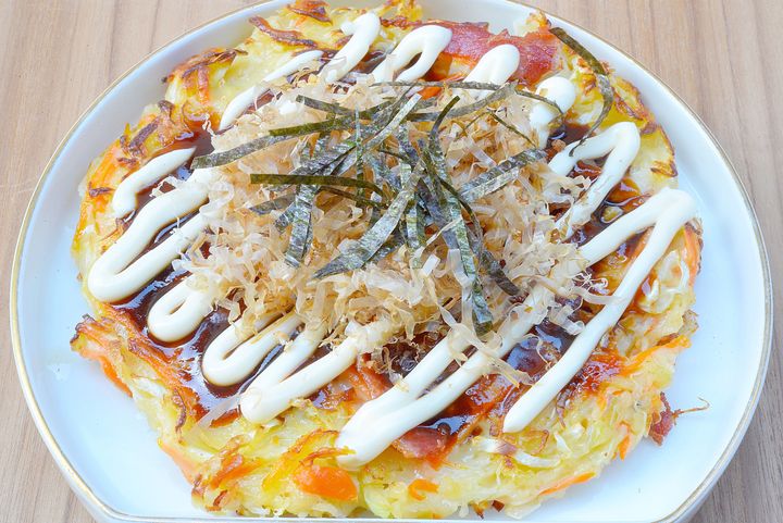 Okonomiyaki, a savory Japanese pancake.