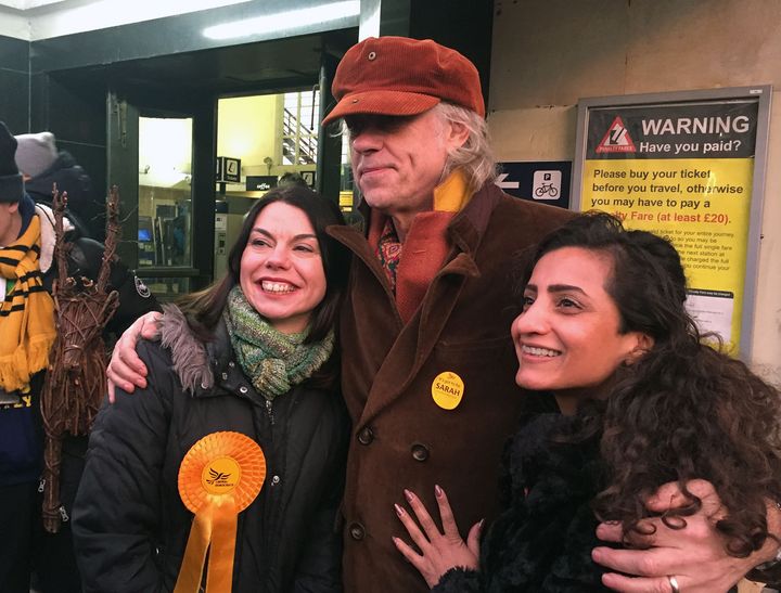 <strong>Geldof (centre) backed Lib Dem candidate Sarah Olney (left), leading a chant of 'Zac is crap'</strong>
