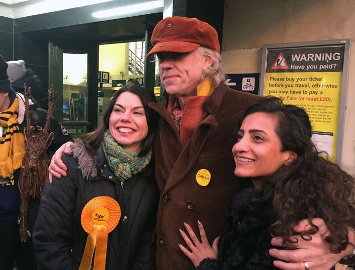 <strong>Geldof (centre) backed Lib Dem candidate Sarah Olney (left), leading a chant of 'Zac is crap'</strong>
