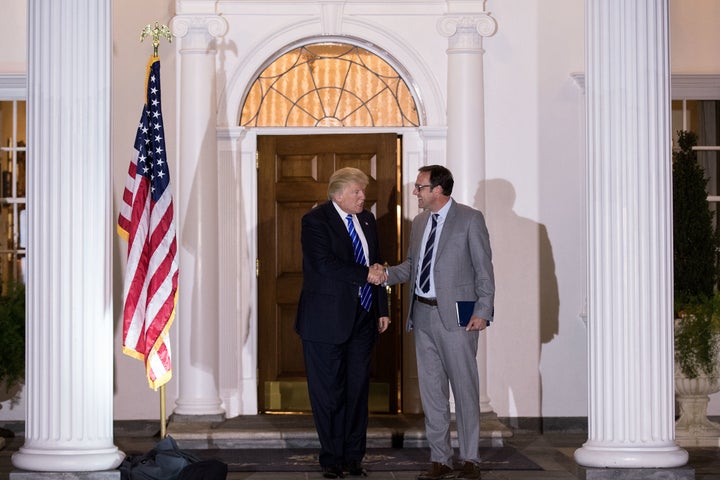 President-elect Donald Trump shakes hands with Todd Ricketts, co-owner of the Chicago Cubs, after their meeting at Trump International Golf Club, Nov. 19, 2016 in Bedminster Township, New Jersey.