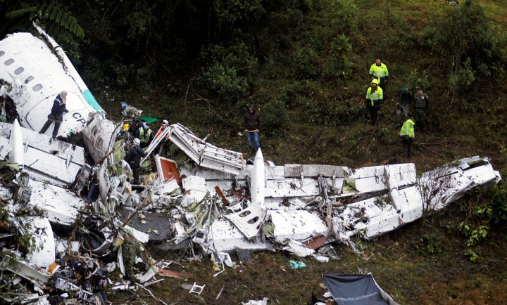 Rescue crew work in the wreckage from a plane that crashed into Colombian jungle with Brazilian soccer team Chapecoense near Medellin, Colombia, November 29, 2016.