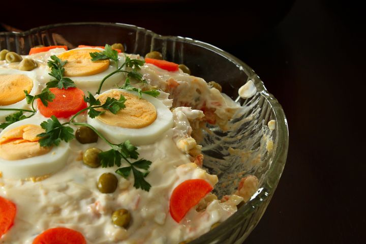 A vegetable salad made with a heavy hand of mayonnaise.