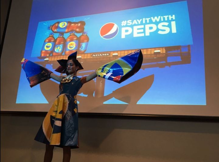 Pepsi dressed fashioned out of Pepsi billboard. 