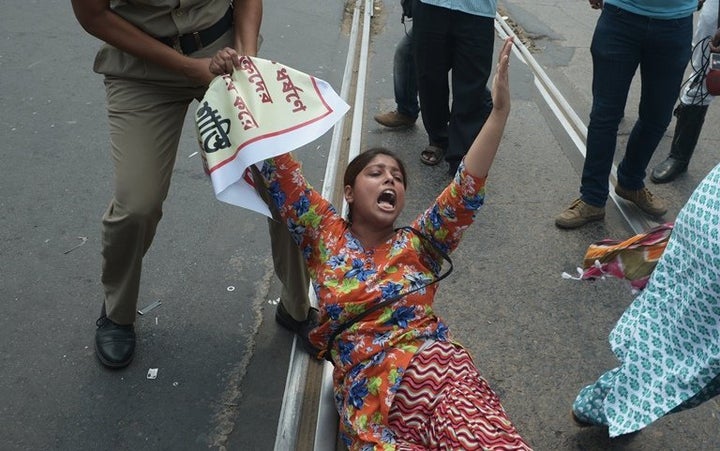 Indian police arrest protesters during a demonstration against a gang rape in Kolkata in May 2016. Women's rights activist Ri