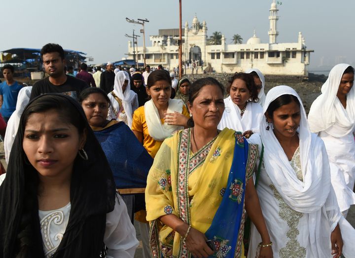 Indian women leave after visiting the inner sanctum of the Haji Ali Dargah in Mumbai on Nov. 29.