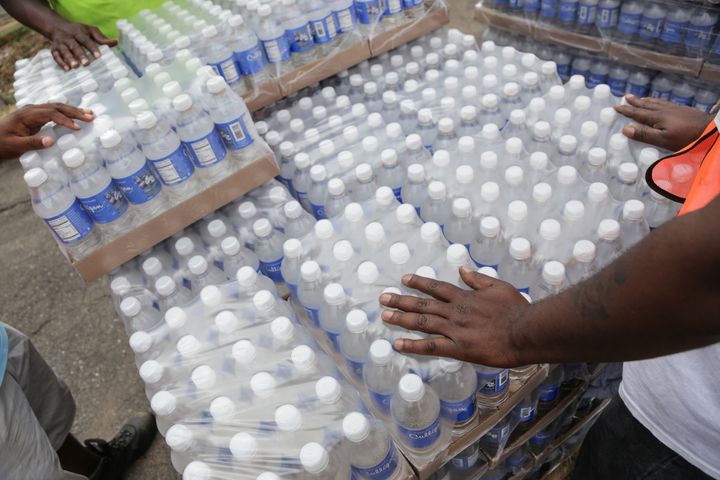Workers hand out bottled water to Flint residents in August 2016.