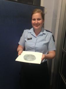 A member of the Maroochydore Police Dept in Australia holds a jellyfish mistaken for a breast implant.