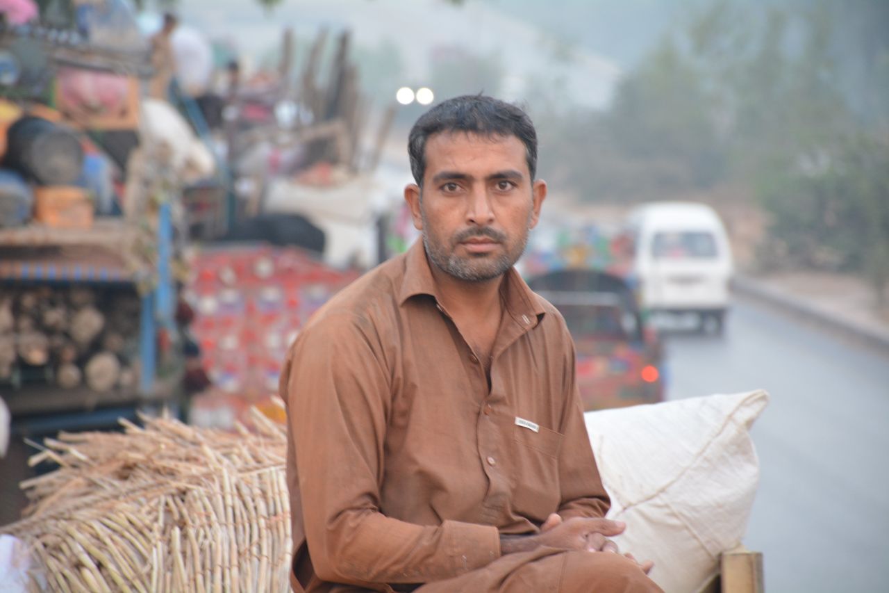 Marjan Khan is one of many Afghan refugees who has made the long trek to a UNHCR repatriation center in Pakistan. He sits atop his belongings as he departs for Afghanistan.