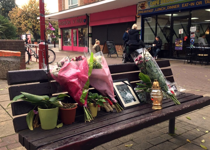 Flowers and candles are seen in a memorial to Arkadiusz Jozwik in Harlow